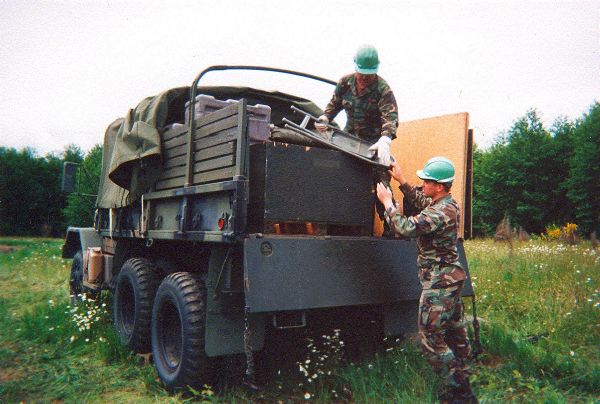 TSgt Thompson and SRA Bomber unloading a duce, Rainier Relay, June 2001